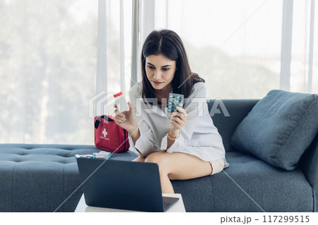 Woman sit down on sofa. healthcare virus protection. health and fever concept. Woman sit down on sofa. healthcare virus protection. health and fever concept. 117299515