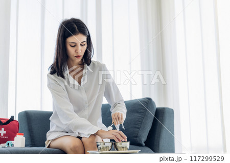 Woman Self healing perform first aid injury Woman Self healing perform first aid injury 117299529