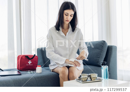 Woman Self healing perform first aid injury 117299537
