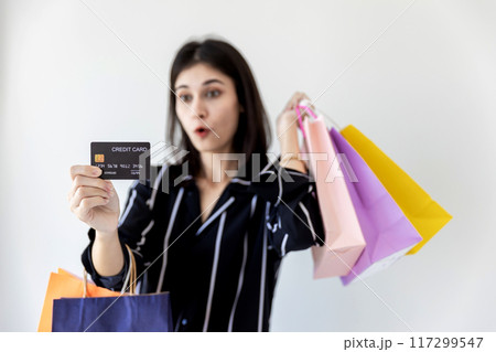 Beautiful girl holding shopping bags. Beautiful girl holding shopping bags. 117299547
