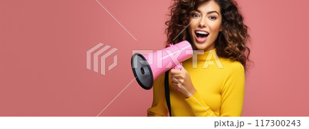 Vibrant promotion - smiling young woman announcing sale offers with megaphone against single colour background, perfect for banner or with ample copy space for text, capturing attention and excitement 117300243