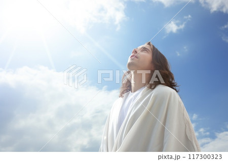 Divine communion: Jesus Christ prays to god the father, illustrating sacred connection between son and e father, embodying humility, devotion, eternal bond of divine love. 117300323