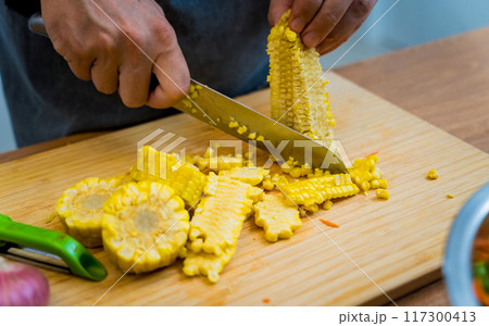 Chef at the kitchen preparing spicy glass noodle salad Chef at the kitchen preparing spicy glass noodle salad 117300413
