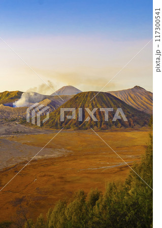Dramatic sunrise over Mount Bromo, showcasing its volcanic cone. Dramatic sunrise over Mount Bromo, showcasing its volcanic cone. 117300541