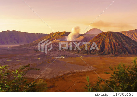 Dramatic sunrise over Mount Bromo, showcasing its volcanic cone. 117300550