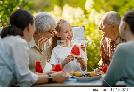 family spending time together in summer morning family spending time together in summer morning 117300794
