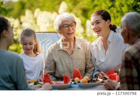 family spending time together in summer morning family spending time together in summer morning 117300798