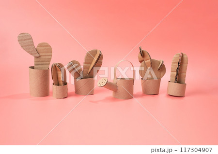 DIY cactus made cardboard, against pink 117304907