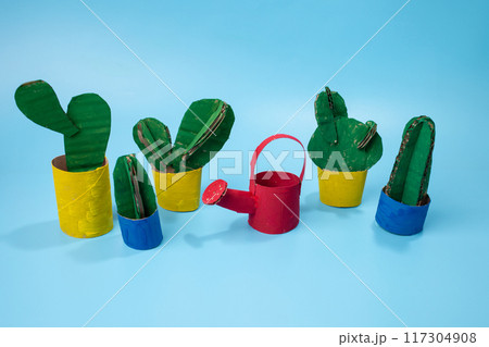 Colorful watering can for flowers and cacti. Paper craft for children. 117304908