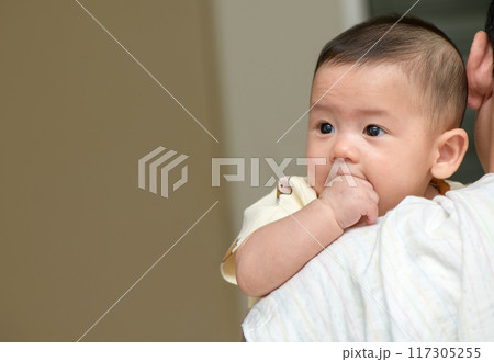 Thumbs or fingers sucking in baby newborn habit for calm and relax. 117305255