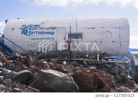 mountain shelters on the slope of Mount Elbrus found on rocky ground after glacier melted 117305323