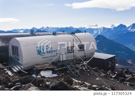 mountain shelters on the slope of Mount Elbrus found on rocky ground after glacier melted mountain shelters on the slope of Mount Elbrus found on rocky ground after glacier melted 117305324