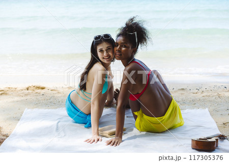 Woman on beach and sand during summer vacation. 117305376