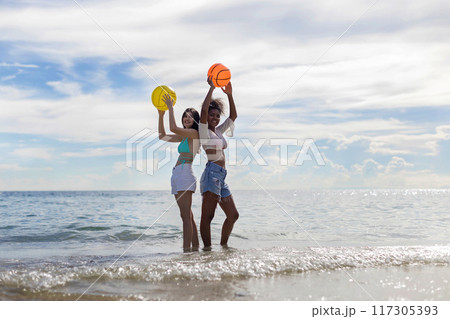 Woman on beach and sand during summer vacation. Woman on beach and sand during summer vacation. 117305393