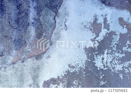 Dusty peeling paint wall background, texture of a concrete old wall with stains and cracks 117305681