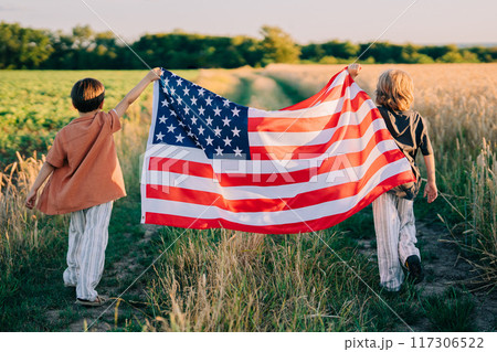 Cute Little Boys - American Patriot Kids Running With National Flag On Open Area 117306522
