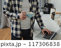 Businessman working at home on paperwork.  117306838
