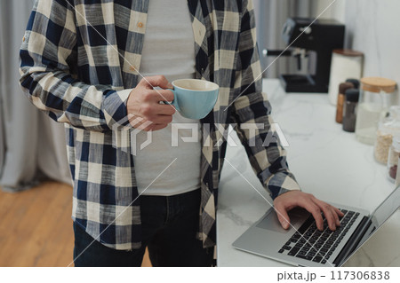 Businessman working at home on paperwork.  117306838