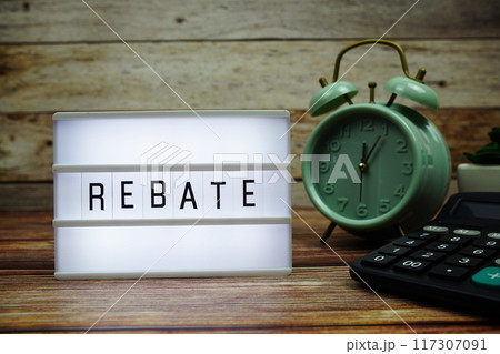 REBATE letterboard text on LED Lightbox on wooden background, business and promotion concept background REBATE letterboard text on LED Lightbox on wooden background, business and promotion concept background 117307091
