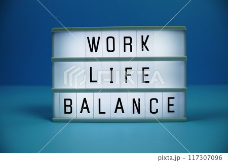Work Life Balance letterboard text on LED Lightbox on blue background Work Life Balance letterboard text on LED Lightbox on blue background 117307096