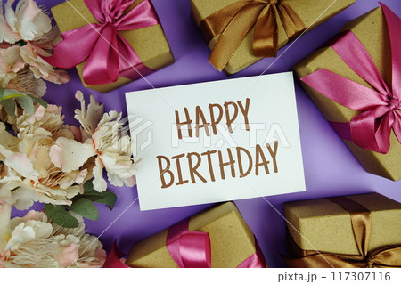 Happy Birthday card with gift box presents on purple background 117307116
