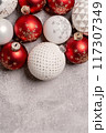 Red and white Christmas baubles border flat lay. Merry Christmas and Happy New Year seasons greetings card. Copy space. Festive border 117307349