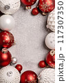 Red and white Christmas baubles frame flat lay. Merry Christmas and Happy New Year seasons greetings card. Copy space. Festive border 117307350