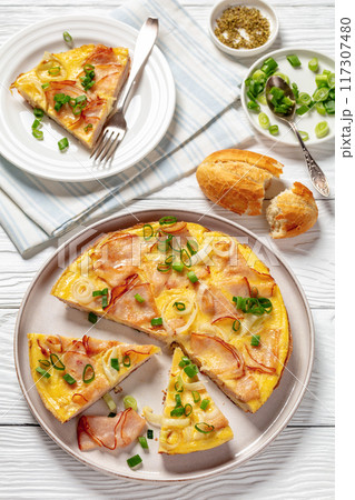 deli ham onion omelette on skillet, top view deli ham onion omelette on skillet, top view 117307480