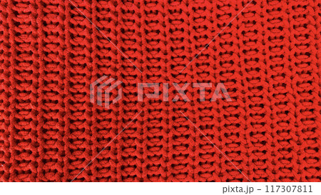 Red knitted wool fabric texture as background 117307811
