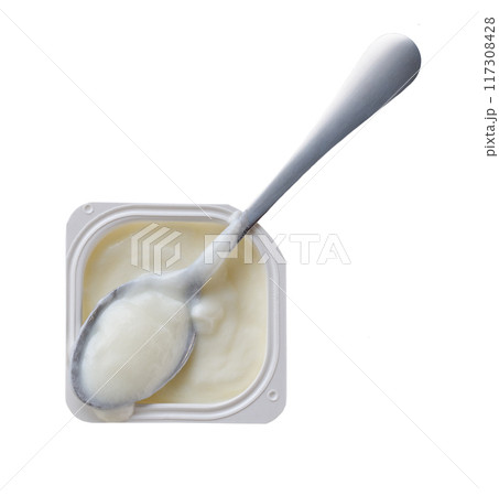 probiotic yogurt in a white plastic cup with a spoon isolated on a white background. Top view. 117308428