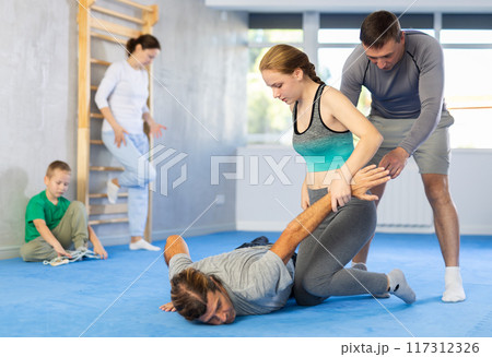 Girl student, with help of male teacher, completes neutralization of opponent 117312326