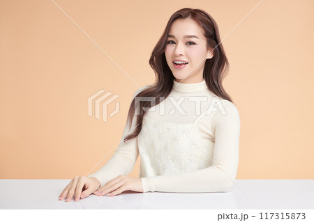 Beautiful young asian woman with clean fresh skin on beige background, Face care, Facial treatment, Cosmetology, beauty and spa, Asian women portrait. 117315873