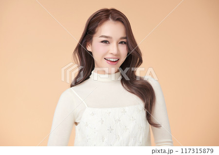 Beautiful young asian woman with clean fresh skin on beige background, Face care, Facial treatment, Cosmetology, beauty and spa, Asian women portrait. Beautiful young asian woman with clean fresh skin on beige background, Face care, Facial treatment, Cosmetology, beauty and spa, Asian women portrait. 117315879