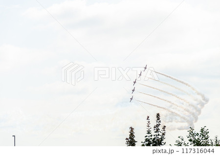 A formation of five aircraft performing display and aerobatics A formation of five aircraft performing display and aerobatics 117316044