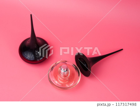 parfume bottle spray elegance on pink background parfume bottle spray elegance on pink background 117317498