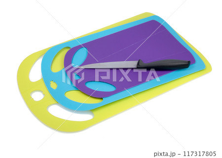 plastic kitchen cutting board with knife isolated on the white plastic kitchen cutting board with knife isolated on the white 117317805