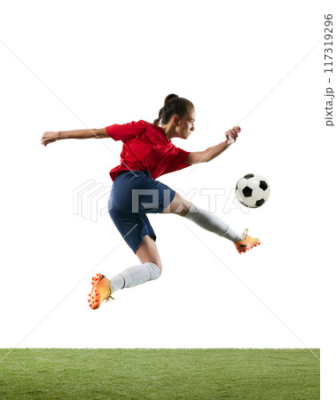 Young, athlete, female football player intense action captured mid-kick, showcasing agility and focus. Young, athlete, female football player intense action captured mid-kick, showcasing agility and focus. 117319296