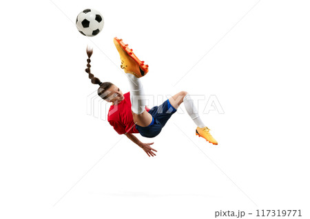 Female soccer player mid-air, executing bicycle kick with precision and power, showcasing athleticism and skill. 117319771