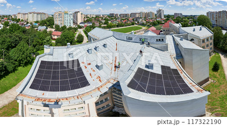 House with solar panels on rooftop for generating electricity through photovoltaic effect. Aerial view of solar power system on roof. Concept of autonomy, power sustainable resources. House with solar panels on rooftop for generating electricity through photovoltaic effect. Aerial view of solar power system on roof. Concept of autonomy, power sustainable resources. 117322190
