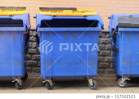 Garbage bins in city. Dustbins being full with garbage. Garbage is pile lots dump. 117322521