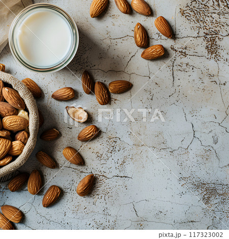 Almonds milk on concrete backgrounds, top view Almonds milk on concrete backgrounds, top view 117323002