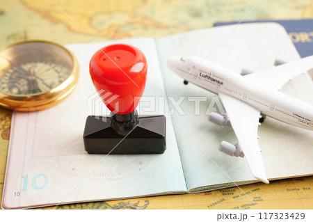 Visa and passport with approved stamp on document for tourism to immigration at airport in country. Visa and passport with approved stamp on document for tourism to immigration at airport in country. 117323429