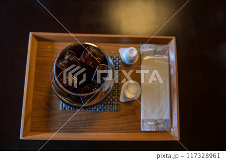 Ice Americano black coffee with sugar syrup and milk cream cup 117328961