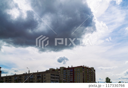 Mushroom-shaped cloud over a residential building 117330766