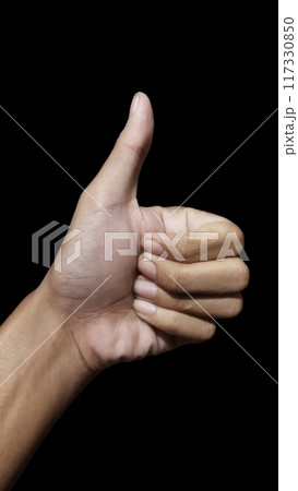 hand showing thumb up on black background hand showing thumb up on black background 117330850