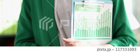 Female manager holding financial documents with charts and graphs Female manager holding financial documents with charts and graphs 117331093