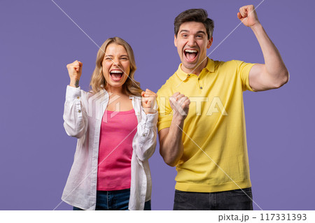 Happy couple, surprised excited on violet background. YEAH, yes, Jackpot concept Happy couple, surprised excited on violet background. YEAH, yes, Jackpot concept 117331393