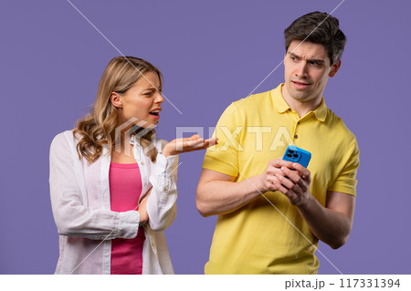 Woman spying on boyfriend chats with smartphone. Jealousy, curiosity, mistrust 117331394