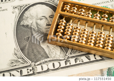 Gold abacus on US dollar banknote money, economy finance exchange trade investment. 117331450