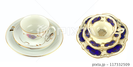 Vintage porcelain cups and saucer isolated on white. Free space for text. Wide photo. Collage. 117332509